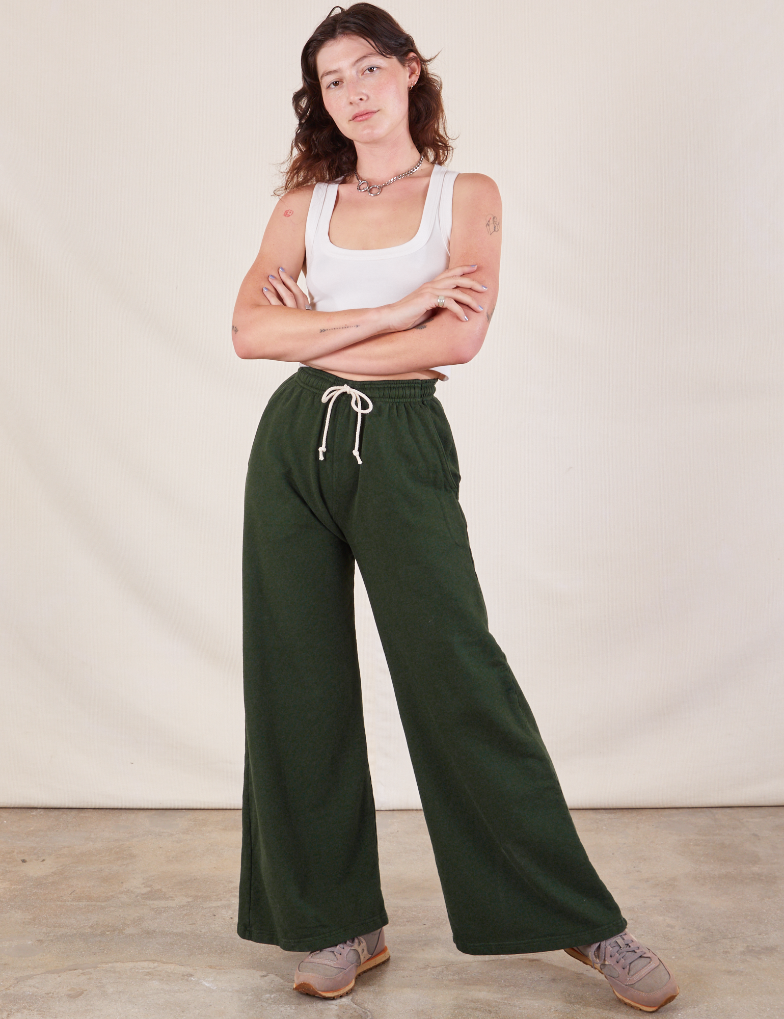 Alex is 5&#39;8&quot; and wearing P Wide Leg Sweat Pants in Swamp Green