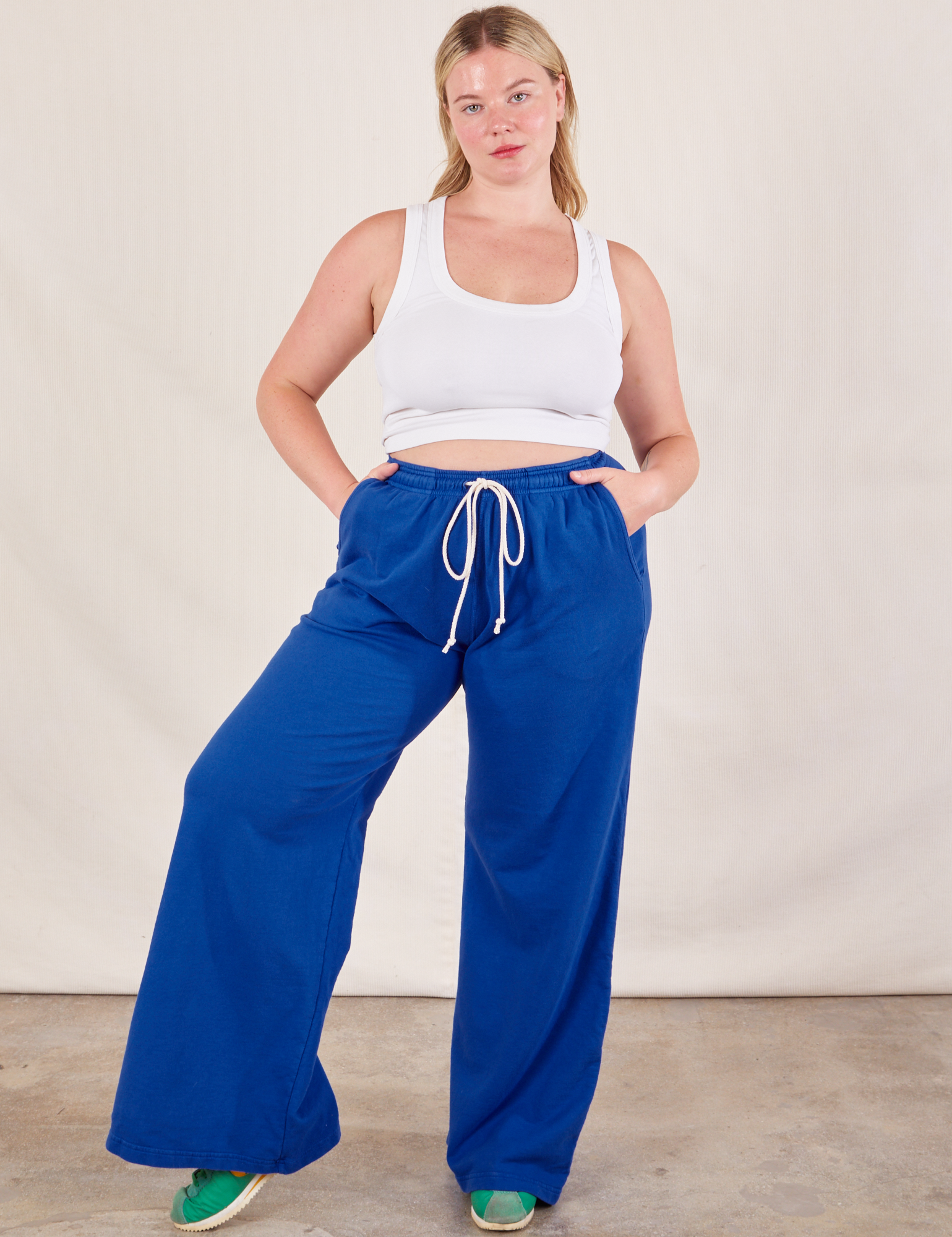 Lish is 5&#39;8&quot; and wearing MWide Leg Sweat Pants in Royal Blue paired with Cropped Tank in vintage tee off-white