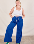 Lish is 5'8" and wearing MWide Leg Sweat Pants in Royal Blue paired with Cropped Tank in vintage tee off-white