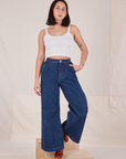 Betty is 5'8" and wearing XXS Indigo Wide Leg Trousers in Dark Wash paired with vintage off-white Cami