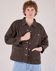 Quinn is 6'4" and wearing L Denim Work Jacket in Espresso Brown