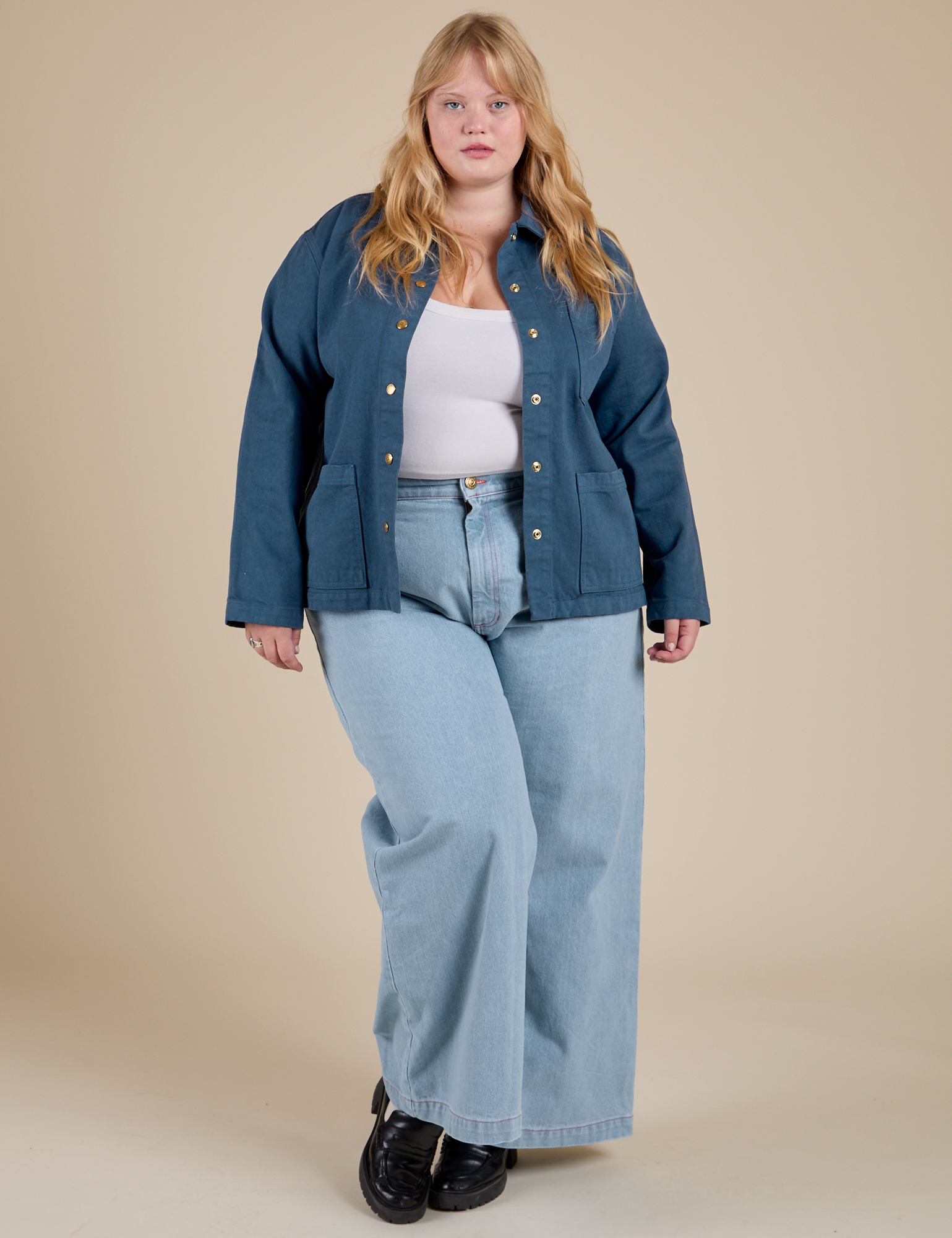 Juliet is wearing Denim Work Jacket in French Blue and light wash Indigo Wide Leg Trousers