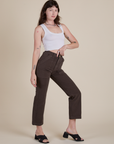 Angled front view of Work Pants in Espresso Brown and Cropped Tank in Vintage Tee White on Alex