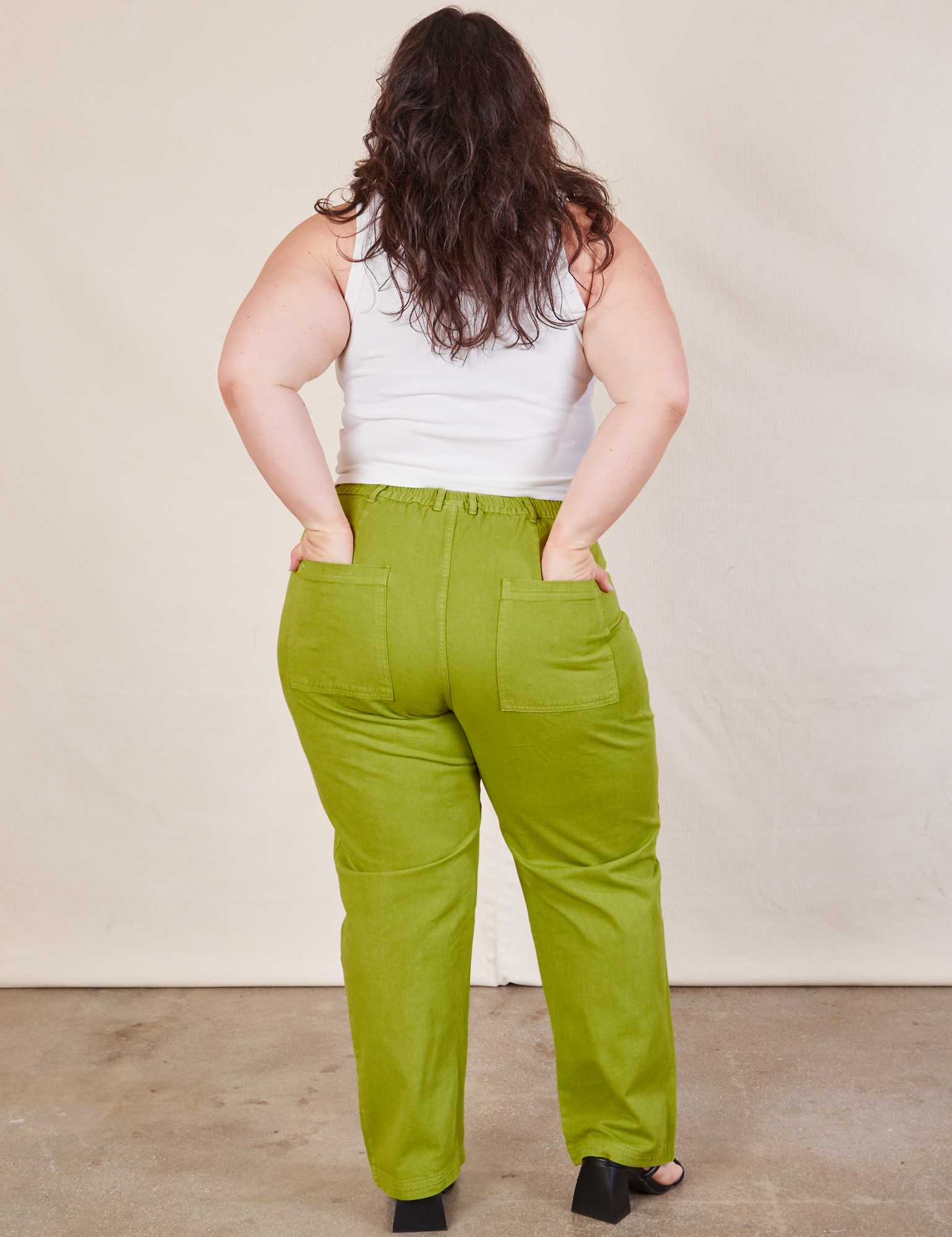 Back view of Work Pants in Gross Green and Cropped Tank in vintage tee off-white on Ashley