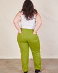 Back view of Work Pants in Gross Green and Cropped Tank in vintage tee off-white on Ashley