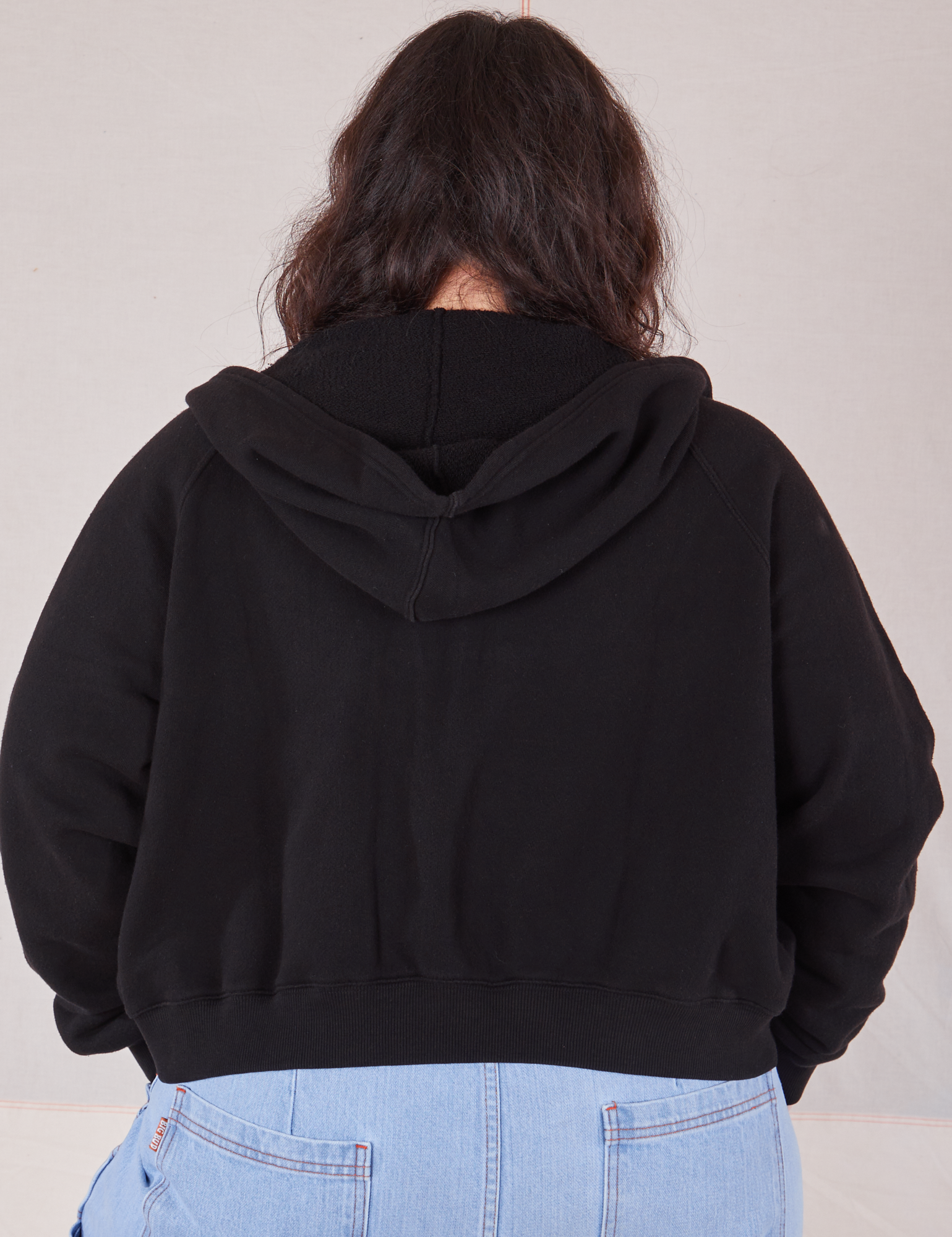 Cropped Zip Hoodie in Basic Black back view on Ashley