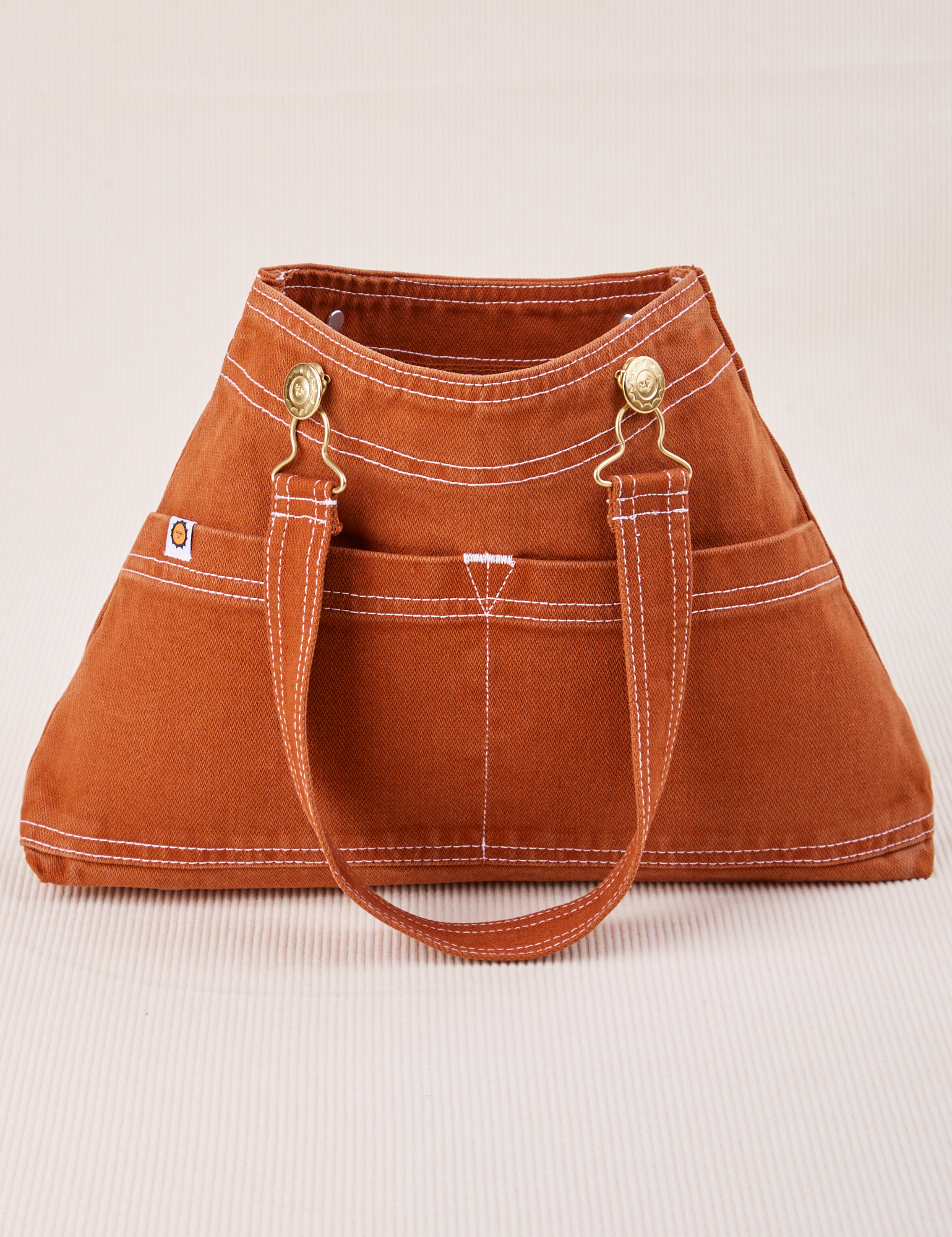 Overall Handbag in Burnt Terracotta with handle strap down across front