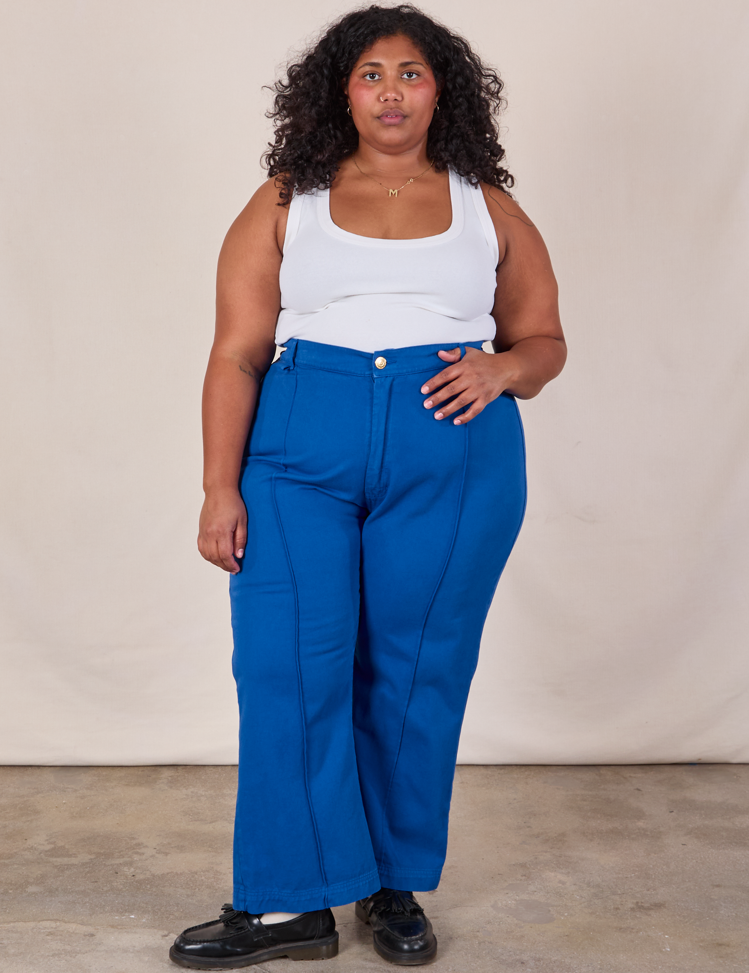 Morgan is 5&#39;5&quot; and wearing 2XL Western Pants in Royal Blue paired with a Cropped Tank in Vintage Tee Off-White