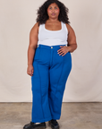 Morgan is 5'5" and wearing 2XL Western Pants in Royal Blue paired with a Cropped Tank in Vintage Tee Off-White