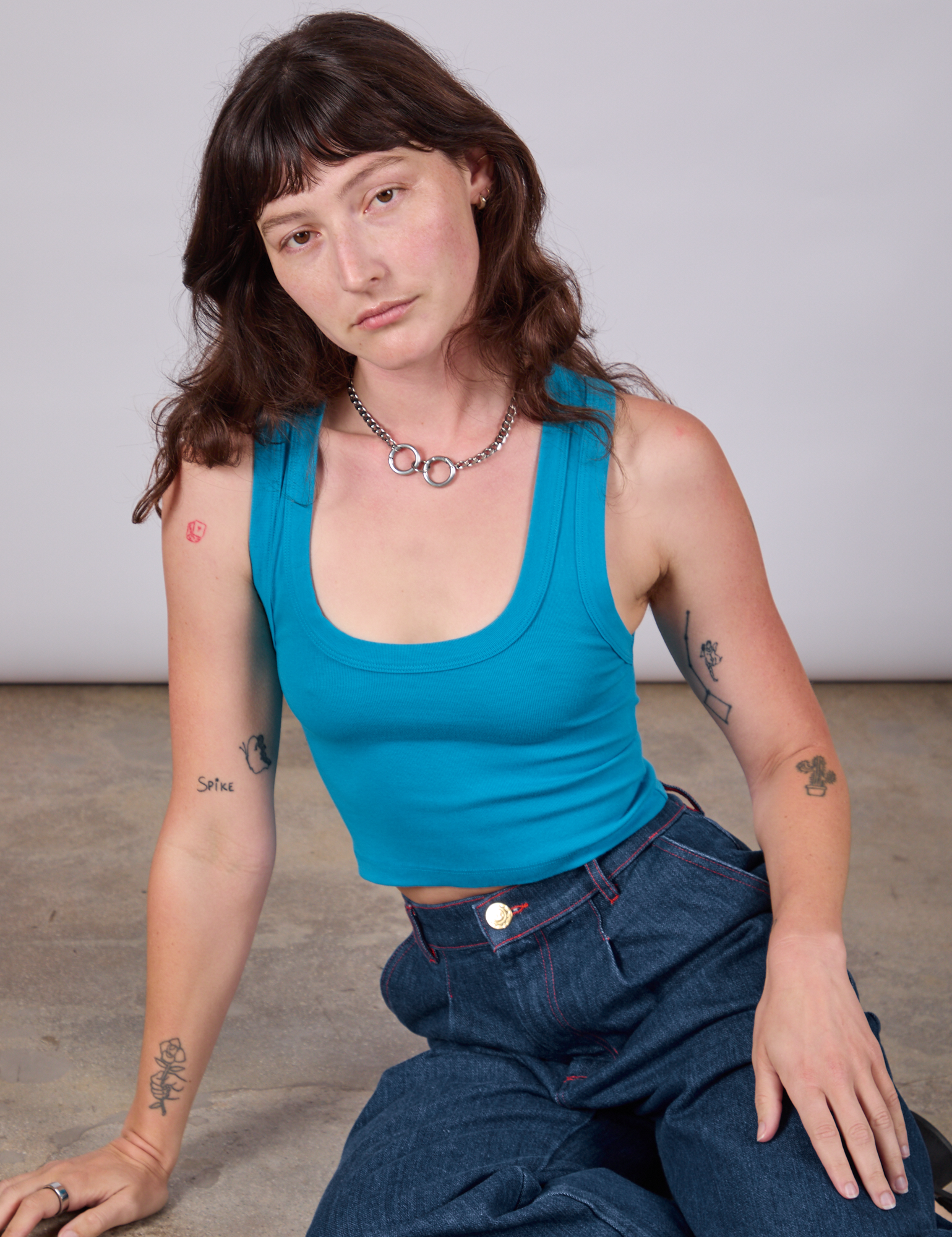Alex is wearing Cropped Tank Top in Hawaiian Blue