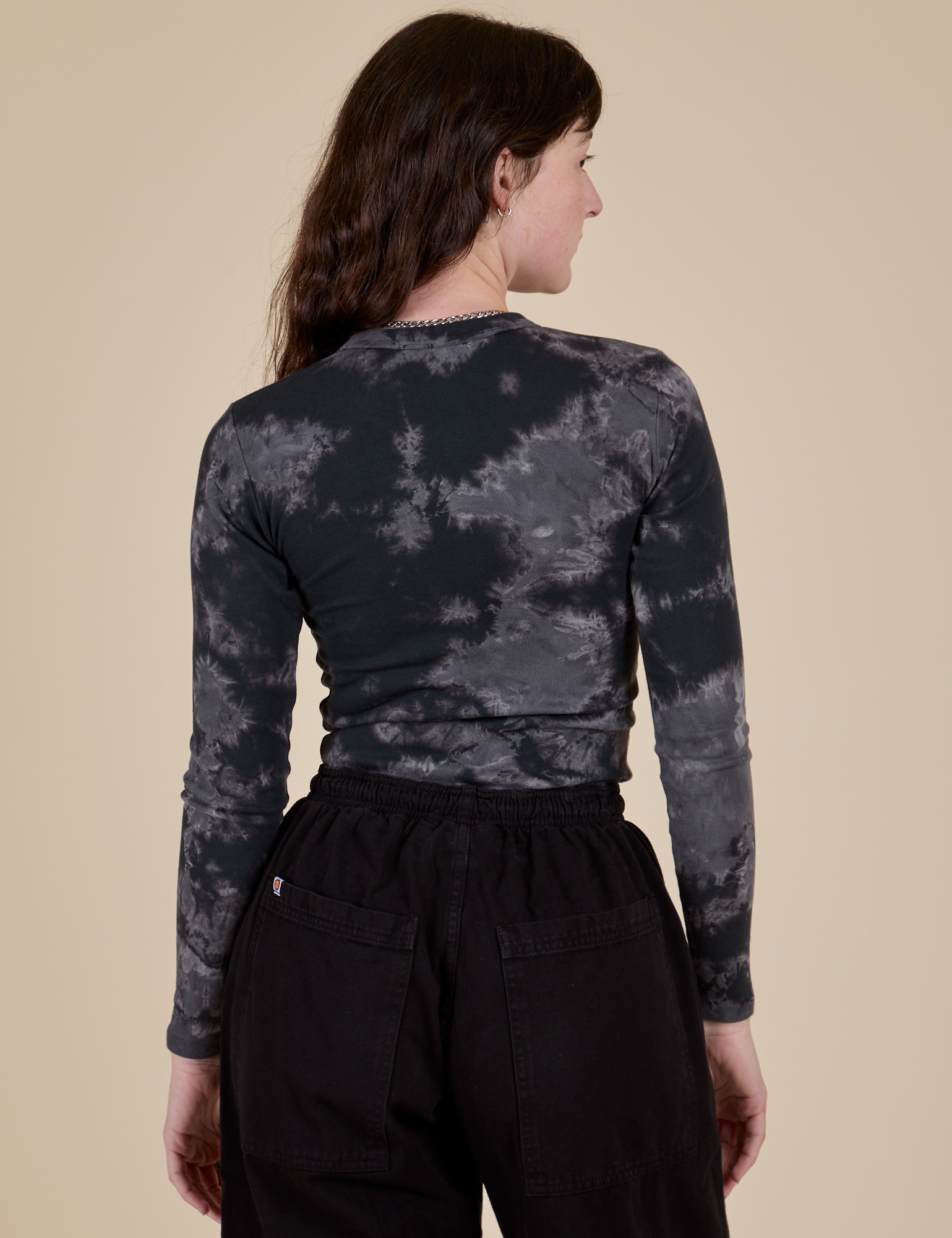 Long Sleeve Baby Tee in Black Magic Waters back view on Alex