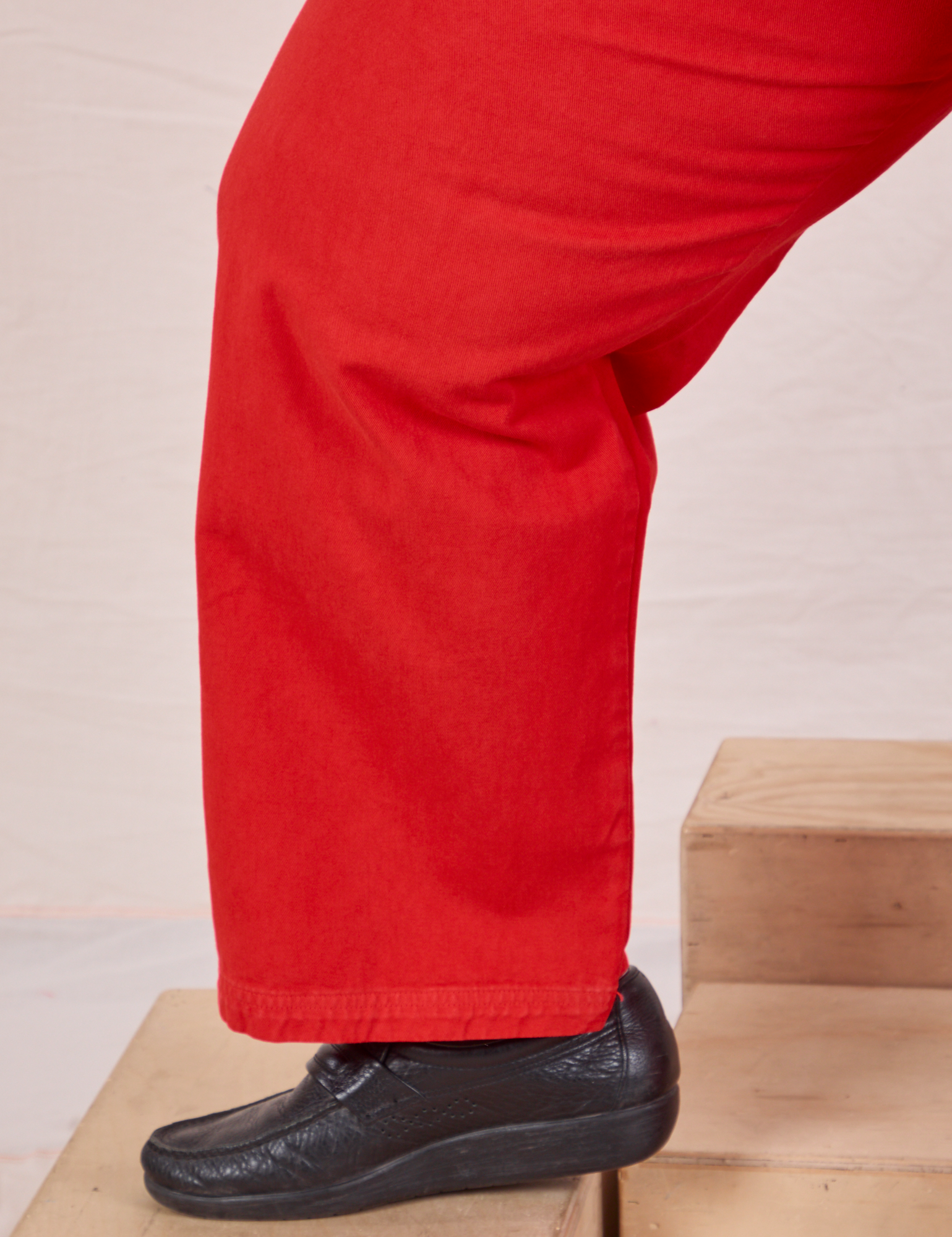 Mid-Rise Work Pants in Mustang Red pant leg close up on Sam