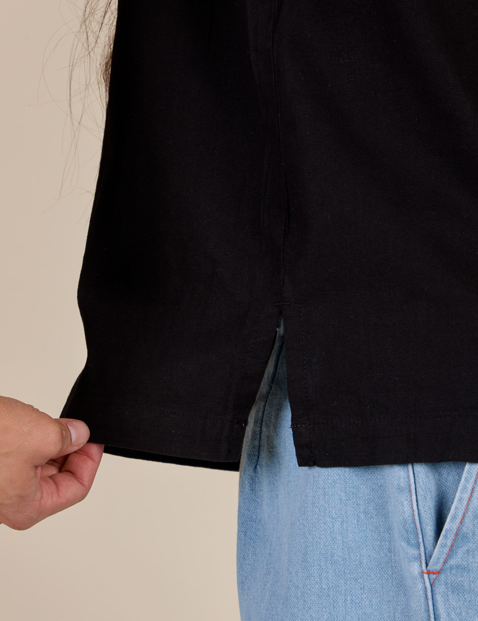 Pantry Button-Up in Basic Black close up of side vent on Anthony