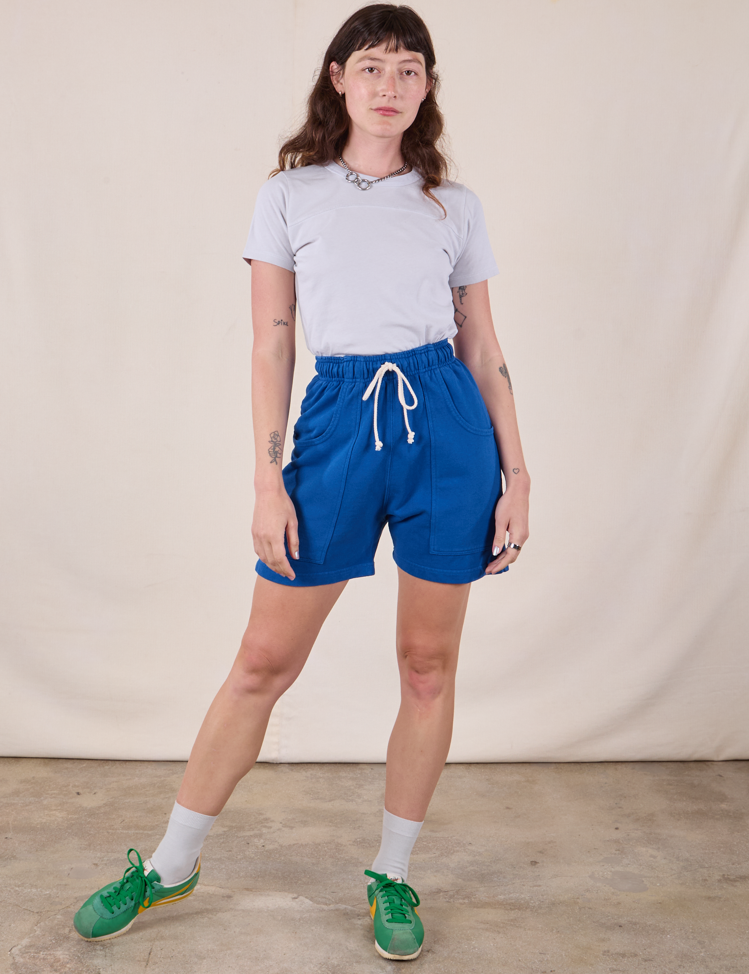 Alex is 5&#39;8&quot; and wearing XXS Sweat Shorts in Royal Blue