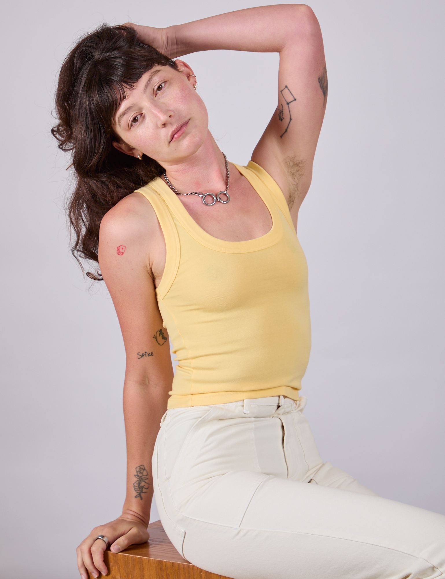 Alex is wearing Tank Top in Butter Yellow