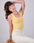 Alex is wearing Tank Top in Butter Yellow
