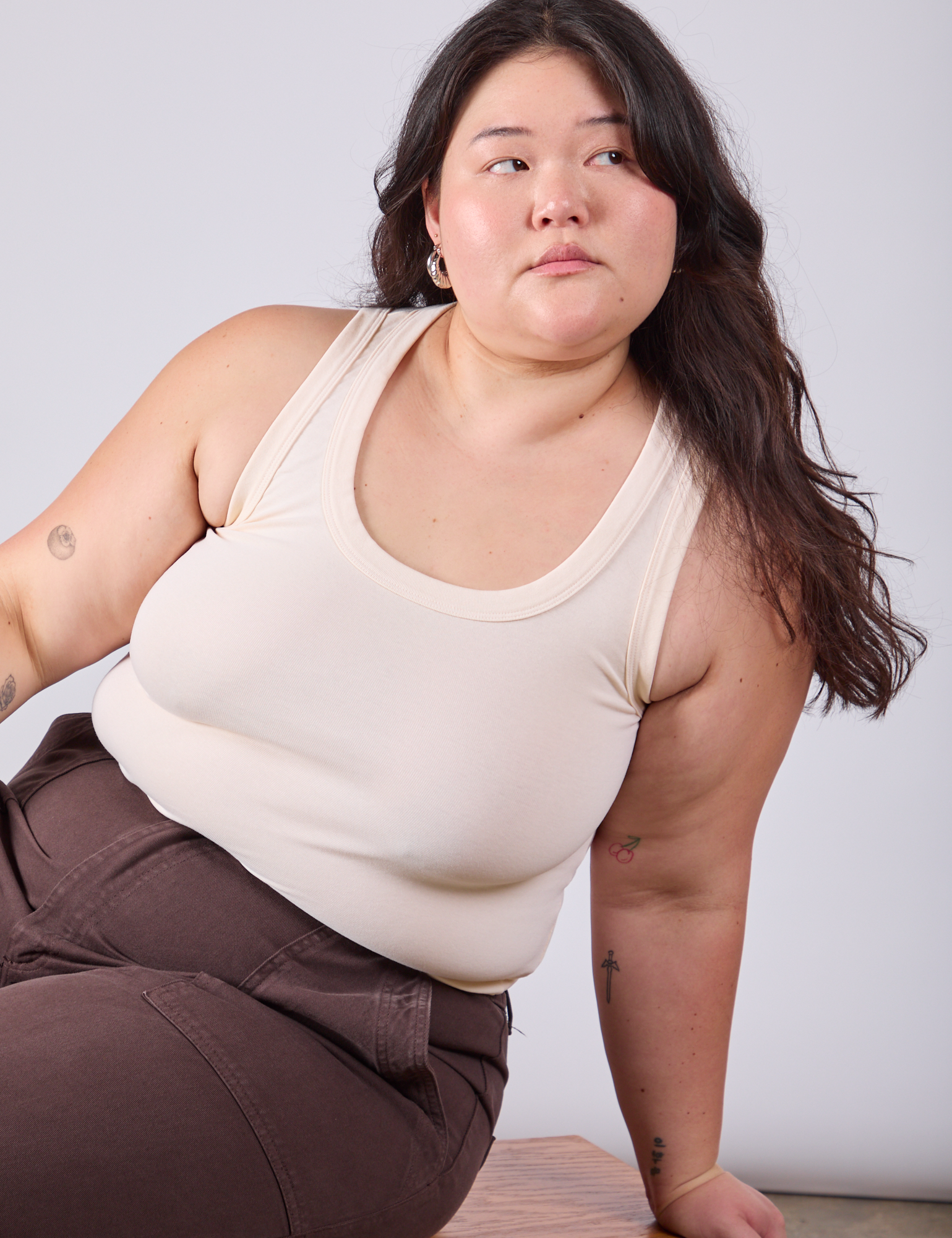 Ashley is wearing Tank Top in Vintage Tee Off-White