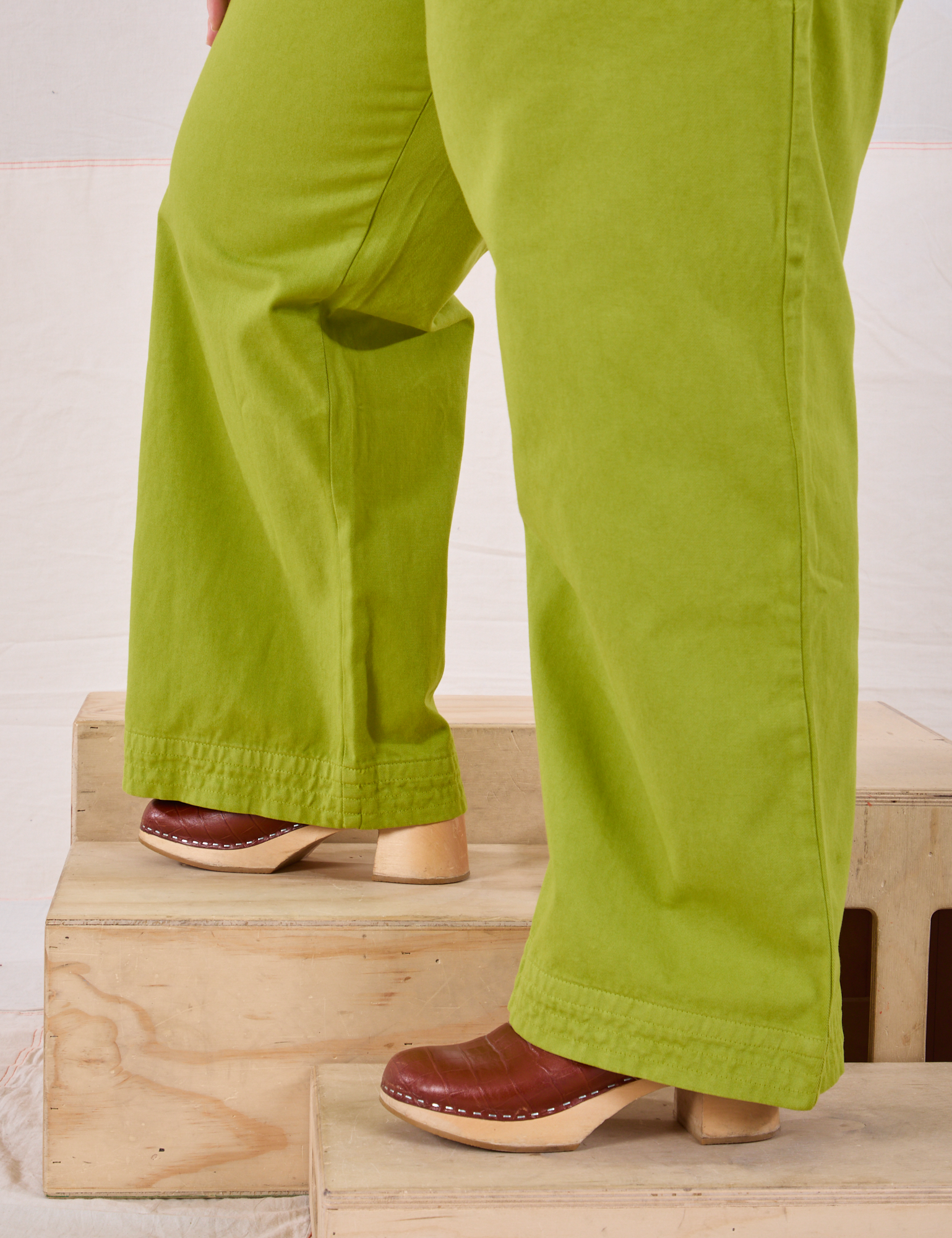 Action Pants in Gross Green pant leg close up on Ashley