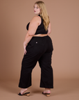 Action Pants in Basic Black angled back view on Juliet