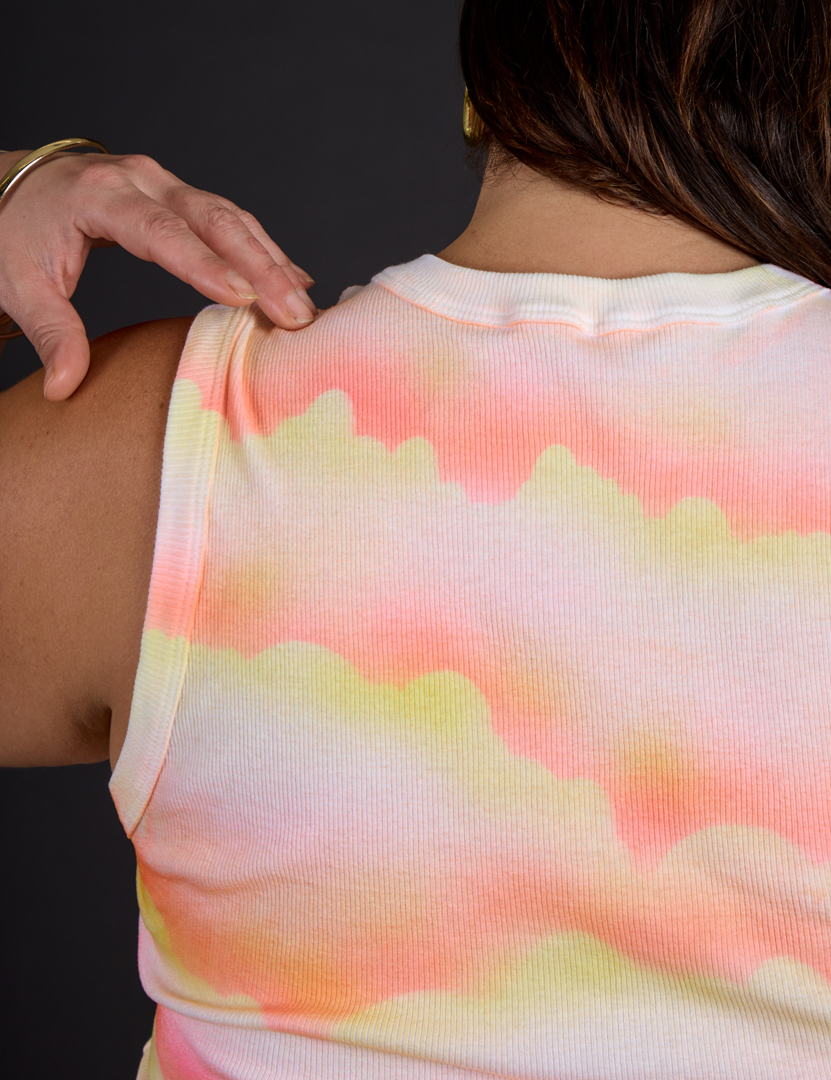 Back view Hem close up of the Black Star Airbrush Muscle Tee on Kristen