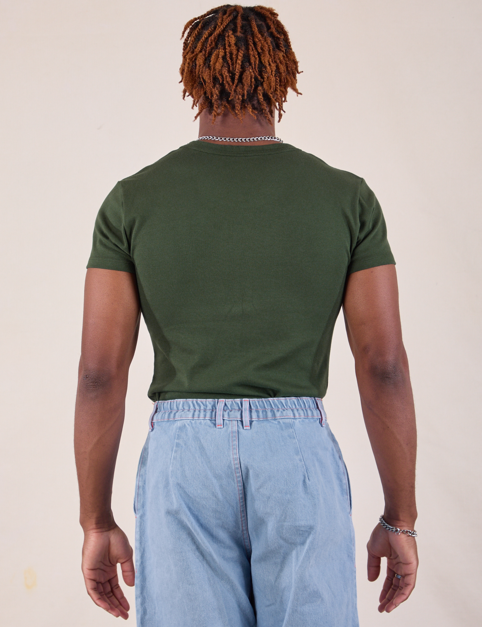 Baby Tee in Swamp Green back view on Isaac