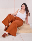 Ashley is wearing Bell Bottoms in Burnt Terracotta and Cropped Tank in vintage tee off-white