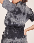 Back view of Short Sleeve Jumpsuit in Black Magic Waters worn by Tiara