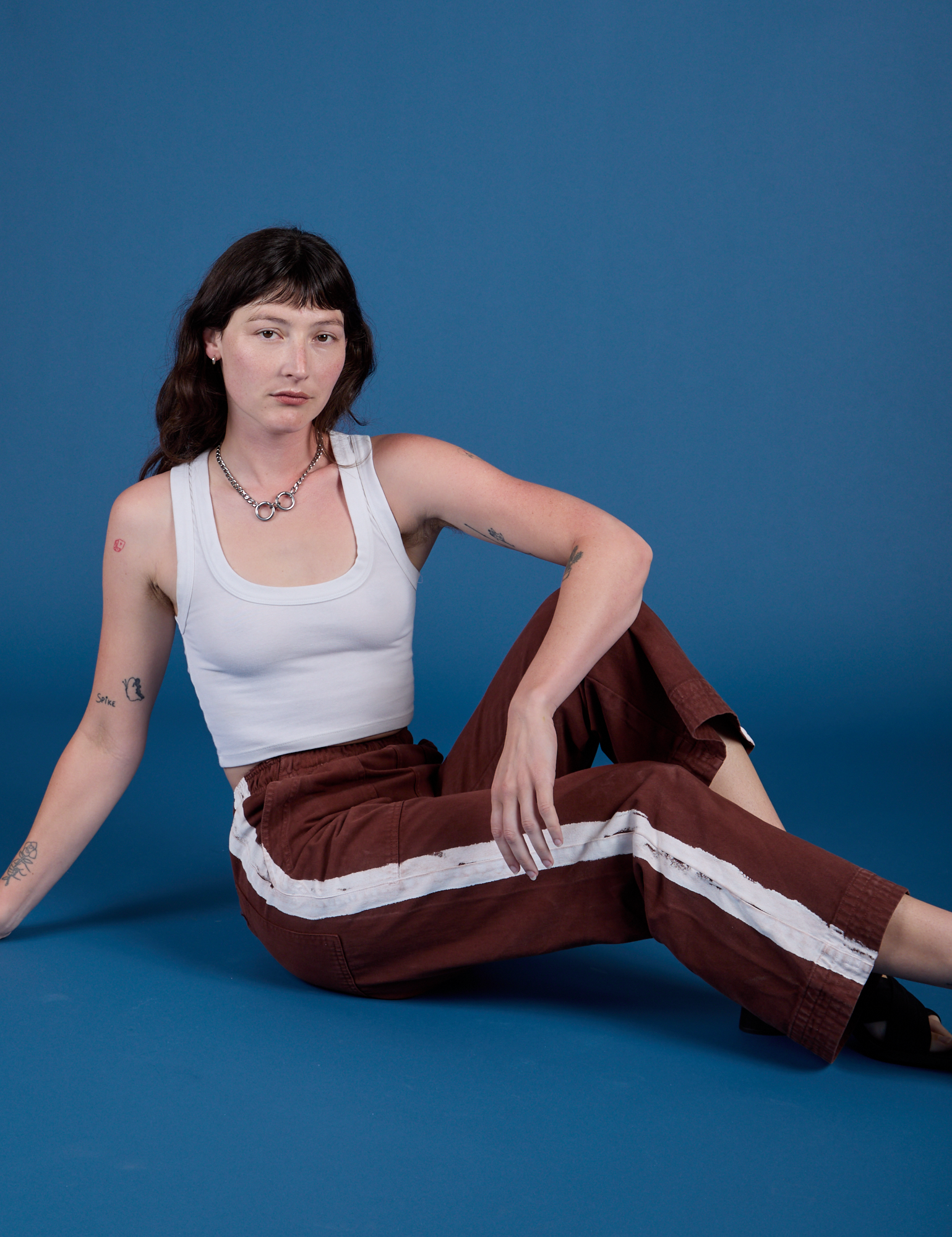 Painted Action Pants in Fudgesicle Brown and Cropped Tank in Vintage Tee White on Alex