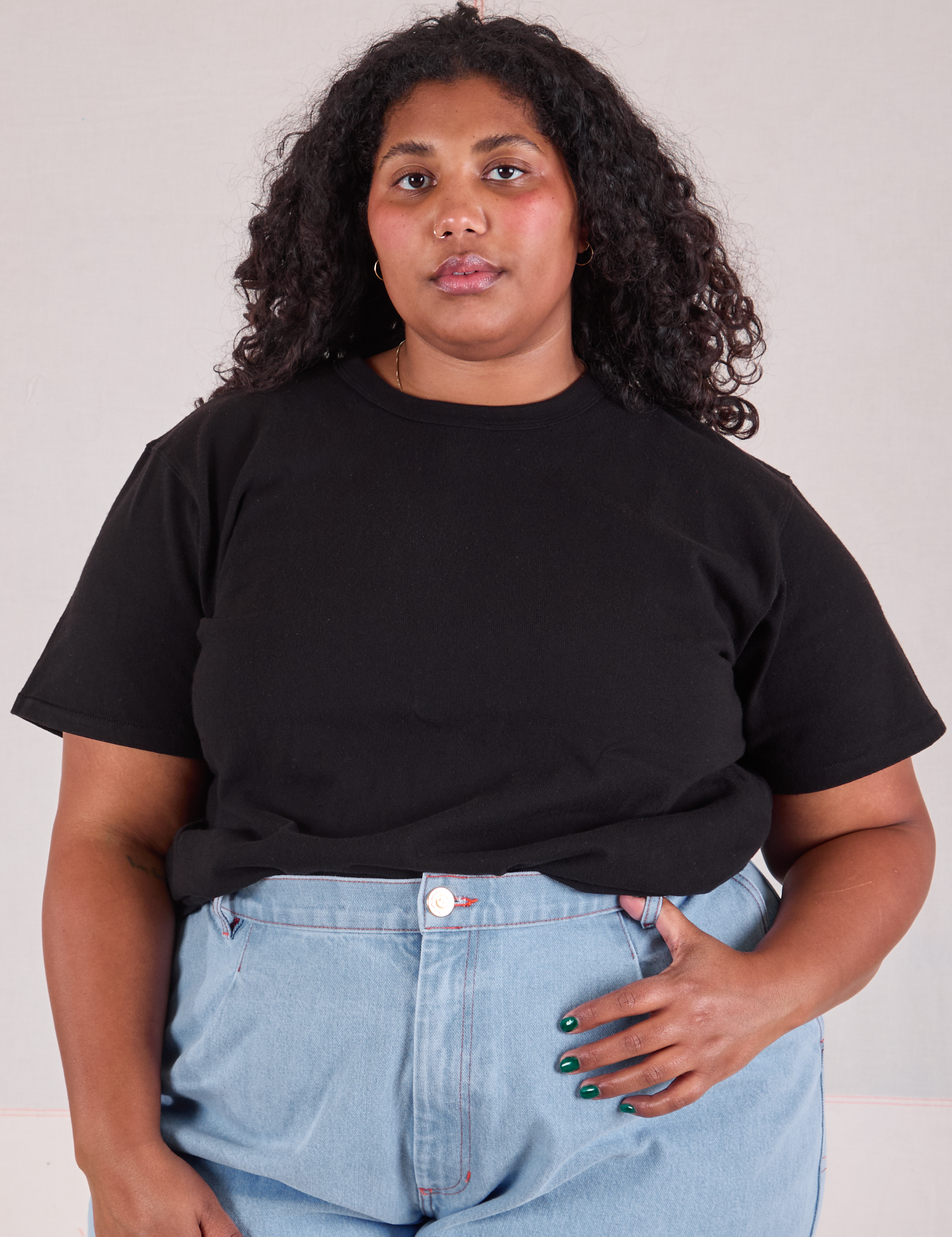 Burly Tee in Basic Black tucked into light wash Denim Wide Leg Trousers on Morgan