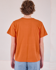 Burly Tee in Construction Orange back view on Quinn