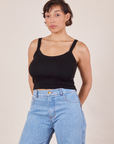 Tiara is wearing XS Cropped Cami in Basic Black paired with light wash Sailor Jeans