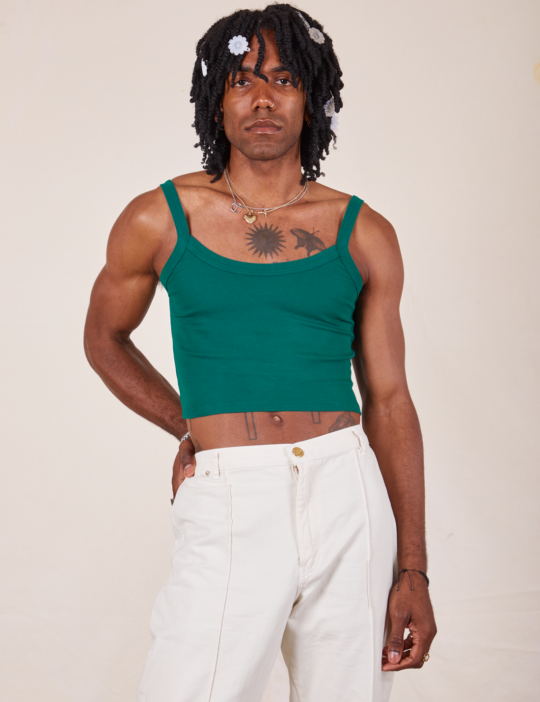 Jerrod is 6'3" and wearing S Cropped Cami in Hunter Green paired with vintage off-white Western Pants