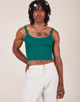 Jerrod is 6'3" and wearing S Cropped Cami in Hunter Green paired with vintage off-white Western Pants