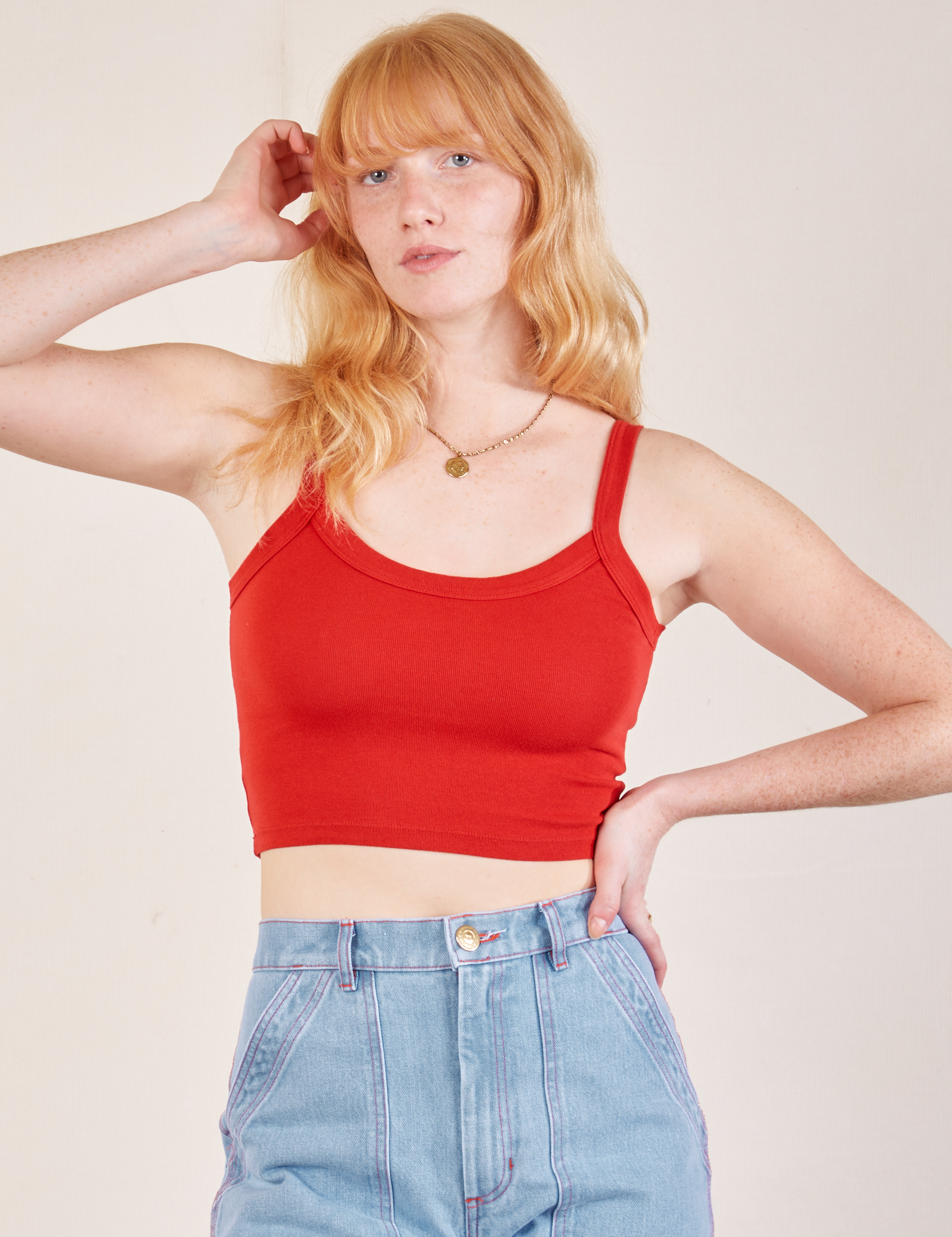 Margaret is 5’11” and wearing P Cropped Cami in Mustang Red