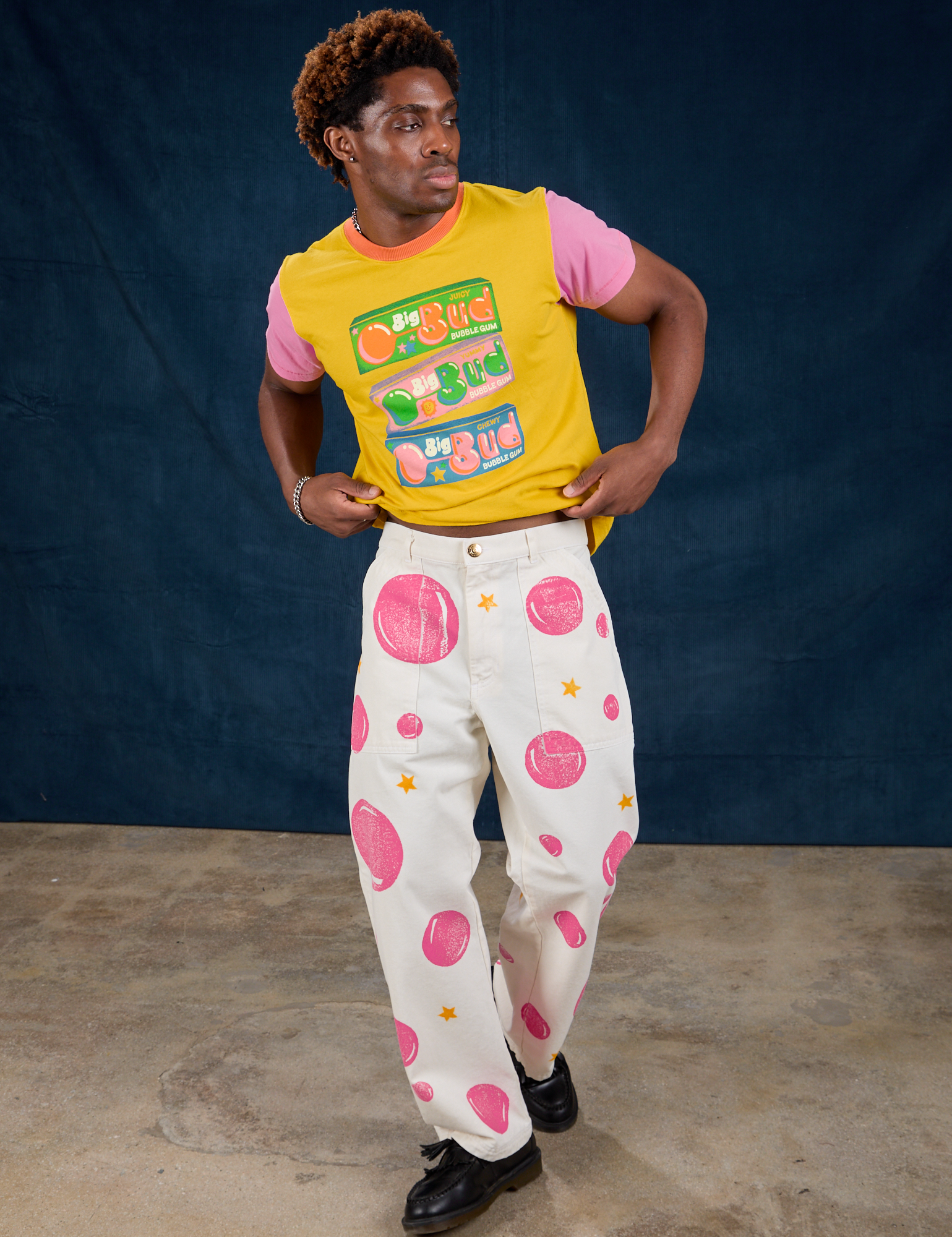 isaac is wearing Paintstamped Work Pants in Bubblegum and Vintage Tee in Bubblegum