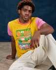Isaac is wearing Vintage Tee in Bubblegum