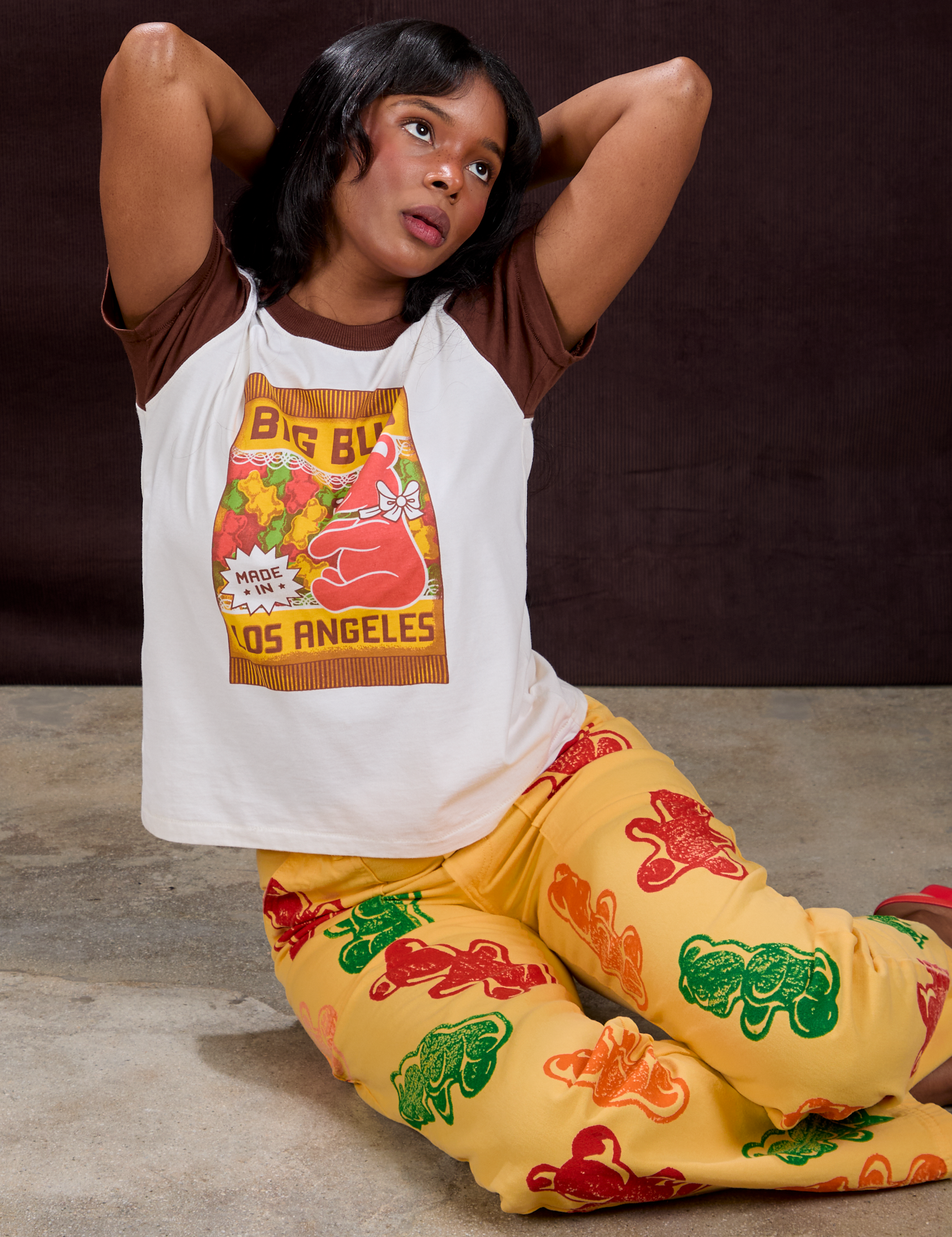 Kandia is wearing Vintage Tee in Gummy Bear and Gummy Bear Paintstamped Work Pants in Butter Yellow