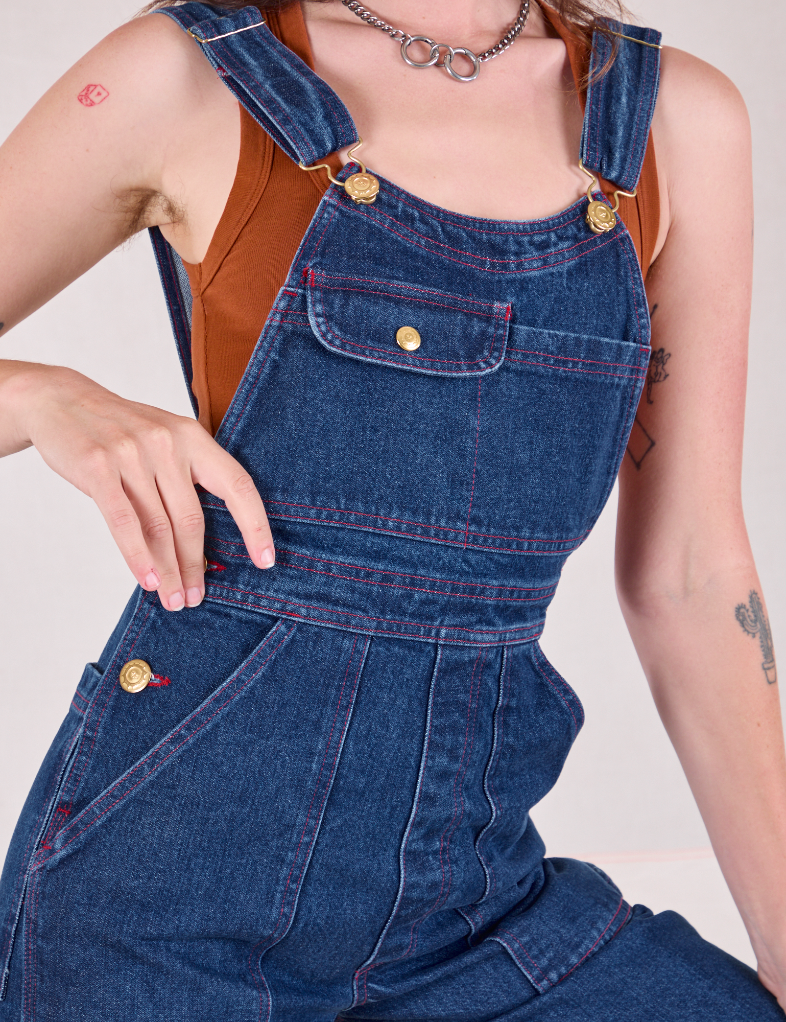 Carpenter Overalls in Dark Wash front close up on Alex