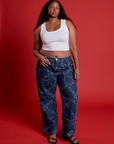Meghna is 5'8" and wearing XL Mid-Rise Carpenter Jeans in Chain Link