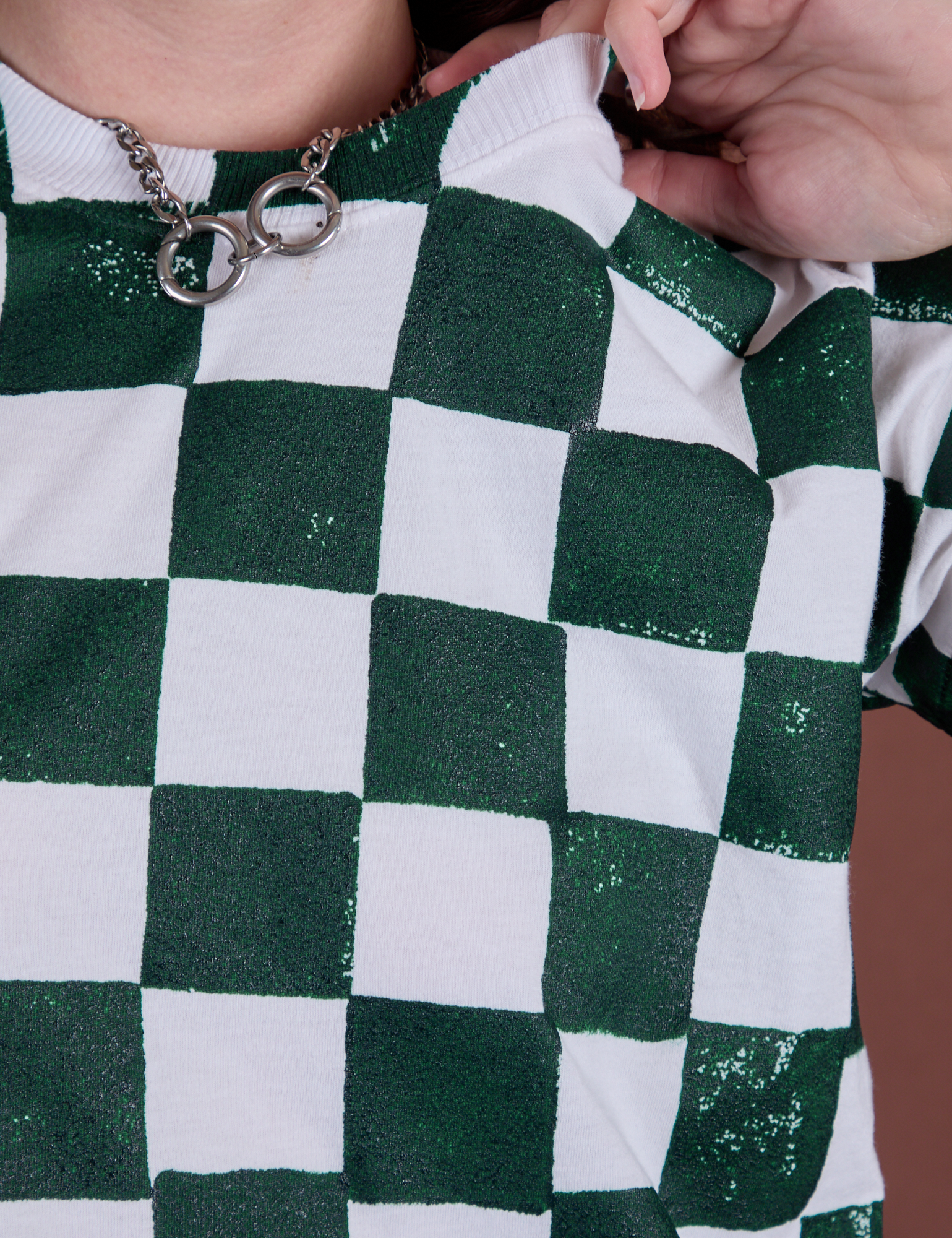 Checker Organic Tee in Swamp Green close up on Alex