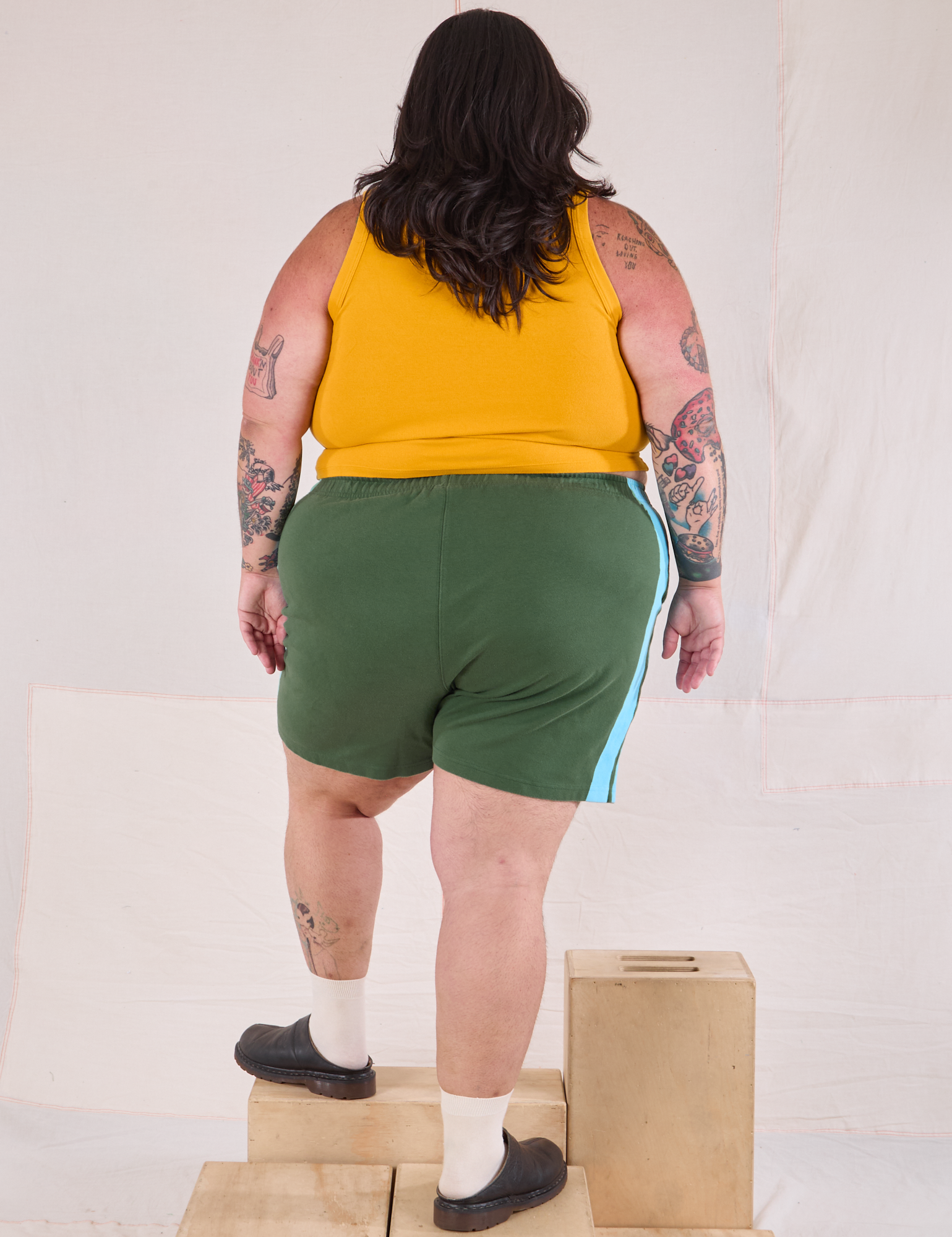 Painted Stripe Easy Shorts in Dark Emerald Green back view on Sam