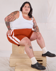 Sam is wearing Painted Stripe Easy Shorts in Paprika and Cropped Tank in Vintage Tee Off-White