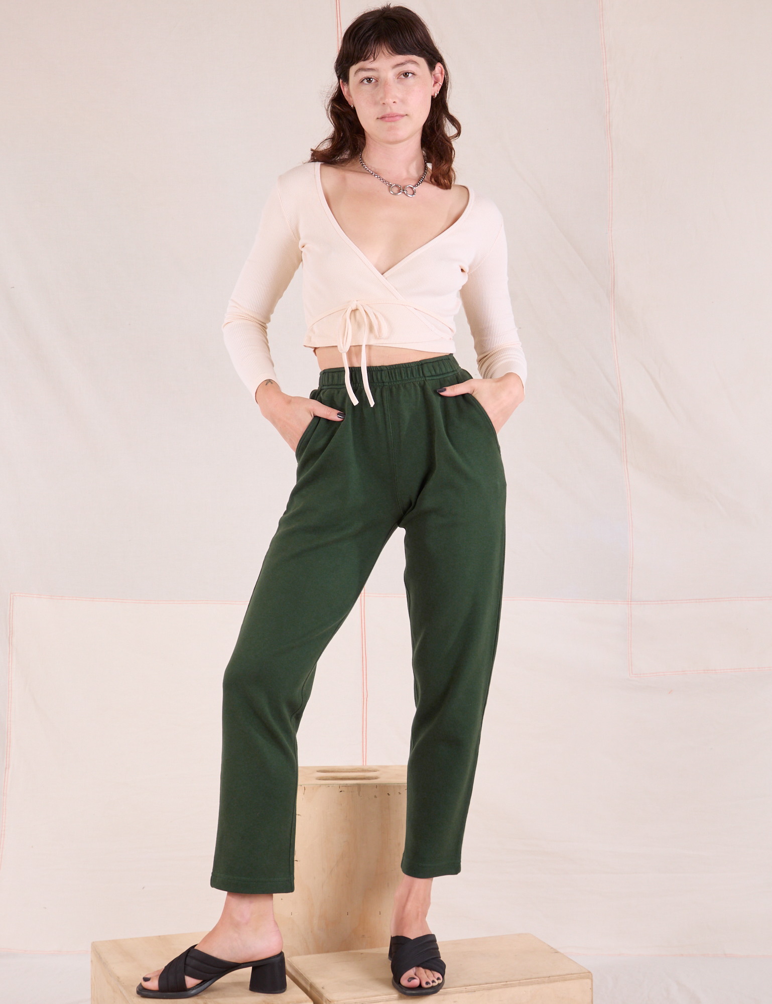 Alex is 5&#39;8&quot; and wearing P Easy Pants in Swamp Green paired with vintage tee off-white Wrap Top