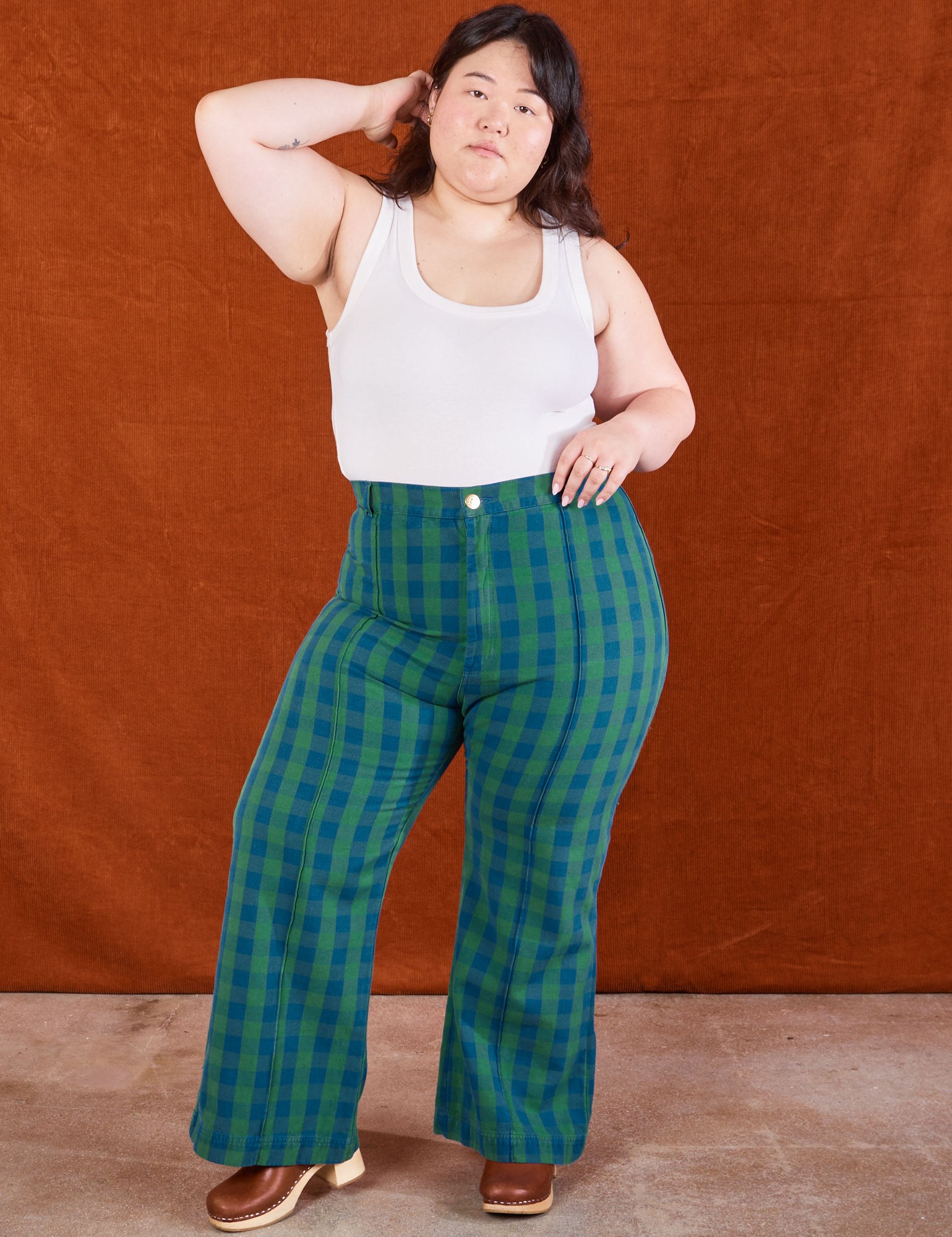 Ashley is wearing Gingham Western Pants in Green and Cropped Tank in vintage tee off-white