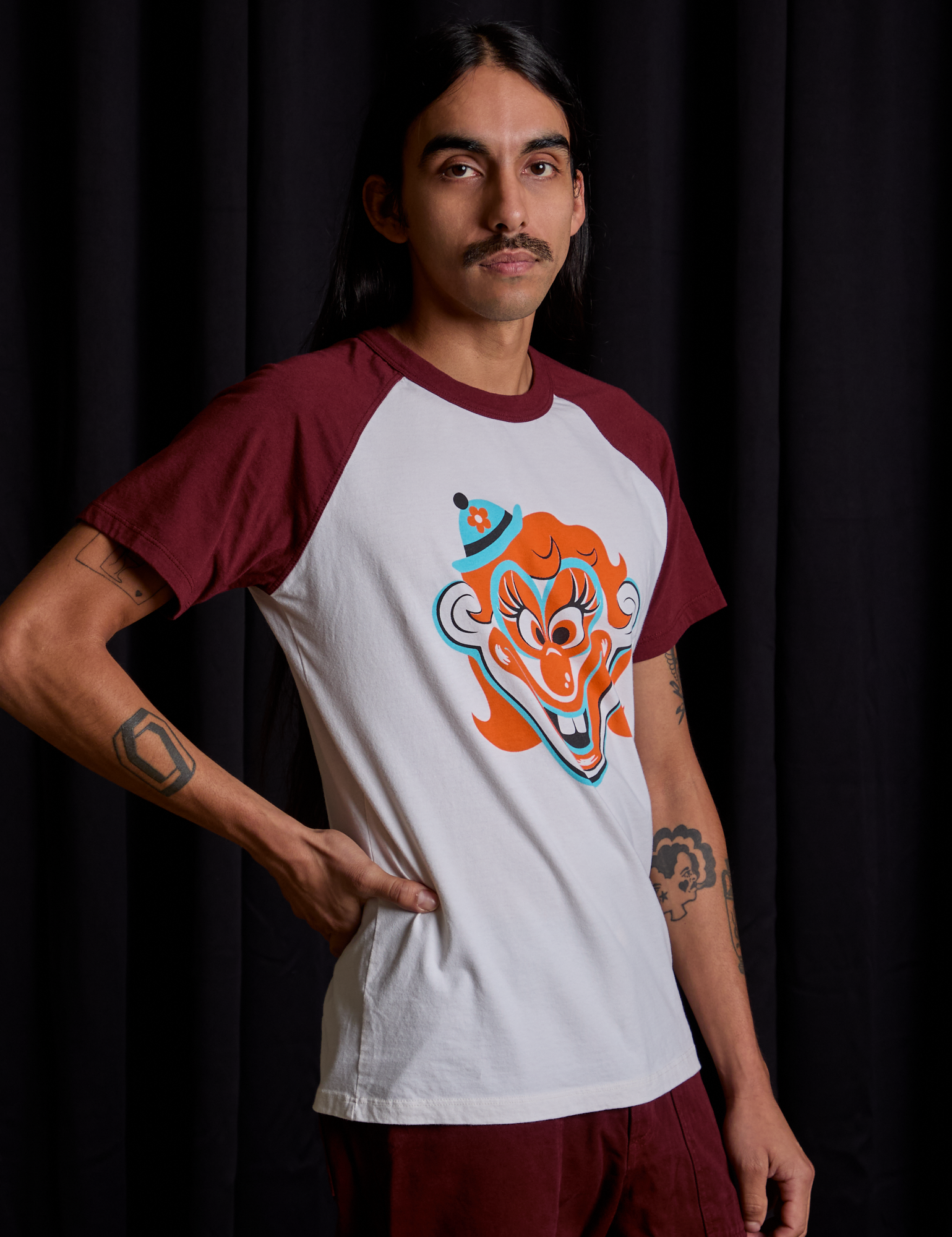 Angled front view of Raglan Tee in Clown on Anthony