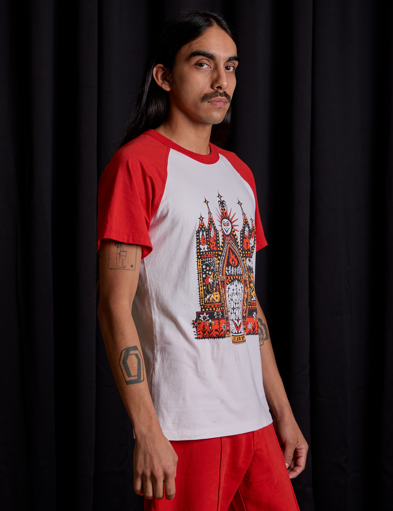 Short Sleeve Raglan Tee in Gates of Hell side view on Anthony