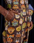 Close up of Jerrod's hand in the front pocket of Short Sleeve Jumpsuit in Halloween Masks