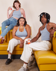 Alex, Alicia and Jerrod are sitting on yellow vinyl booths wearing Halter Top in Periwinkle
