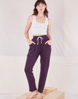 Alex is 5'8" and wearing P Rolled Cuff Sweat Pants in Nebula Purple paired with Cropped Tank in vintage tee off-white