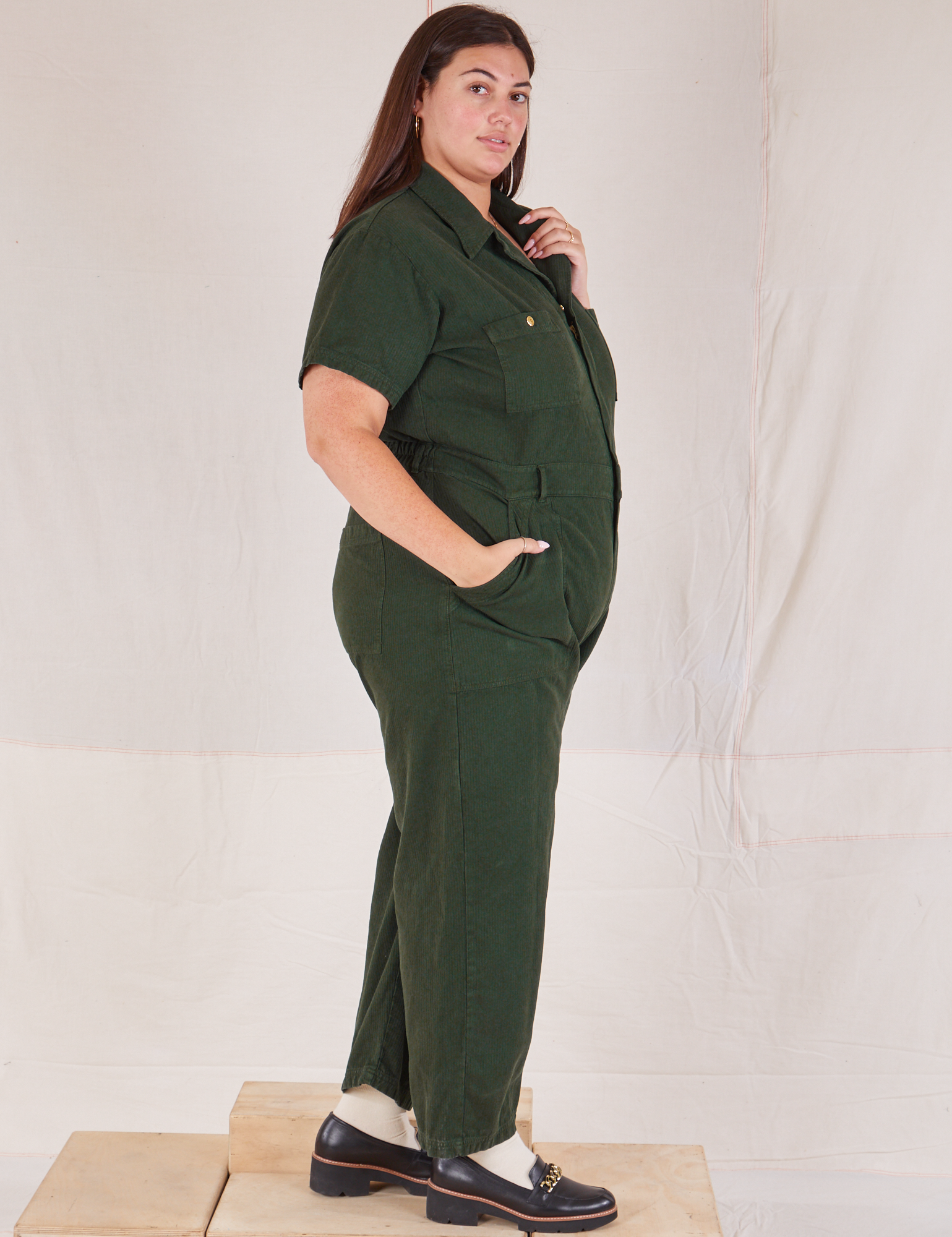 Heritage Short Sleeve Jumpsuit in Swamp Green side view on Katie